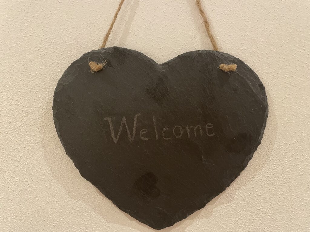 Cuore con scritta Welcome nell’alloggio Il Fiore del Calisio a Villamontagna, Trento, simbolo di accoglienza